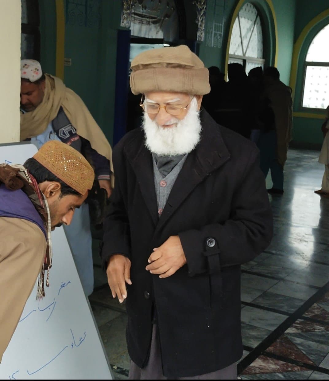 At a gathering in a hall.