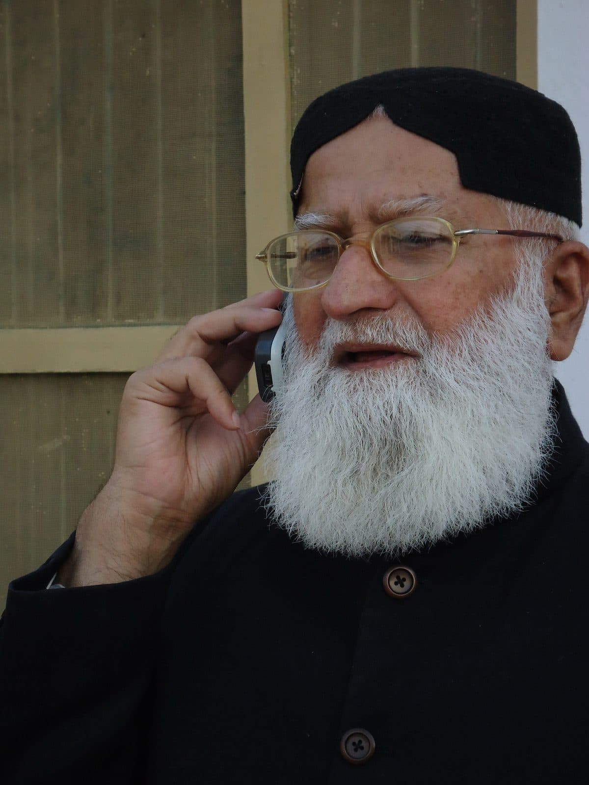 Speaking on the phone outdoors.